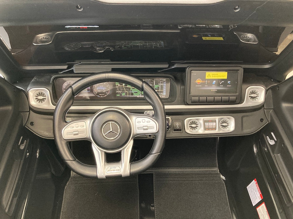 Mercedes G63 XL AMG Deluxe  Kinderauto 24V 4WD zwart metallic twee persoons - Trapautodealer