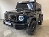 Mercedes G63 XL AMG Deluxe  Kinderauto 24V 4WD zwart metallic twee persoons - Trapautodealer