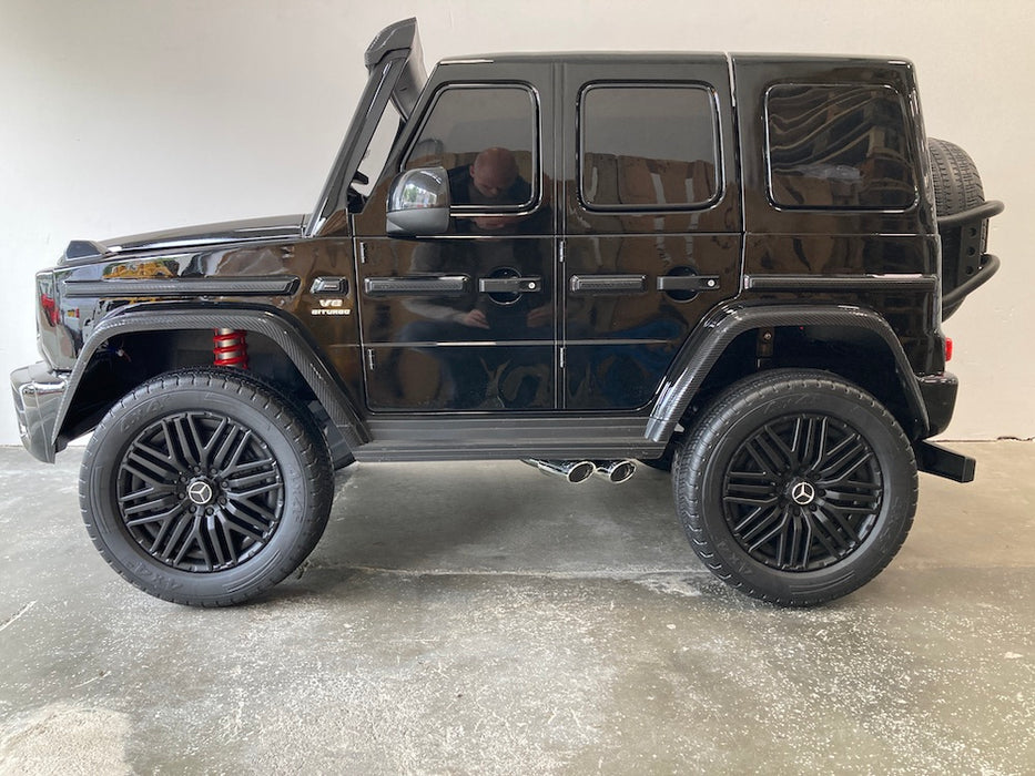 Mercedes G63 XL AMG Deluxe  Kinderauto 24V 4WD zwart metallic twee persoons - Trapautodealer